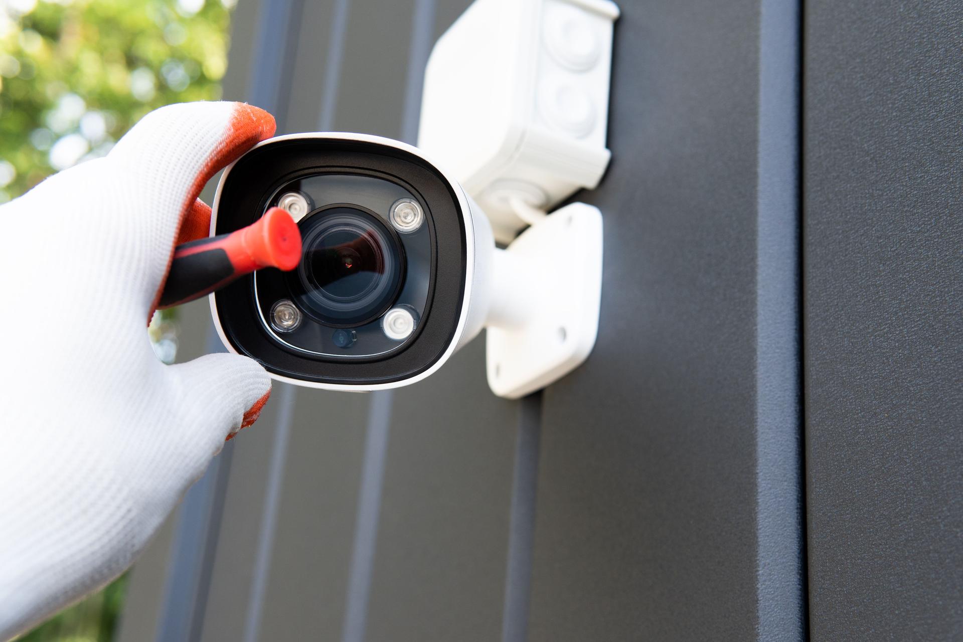 Installer sets up security cam for family
