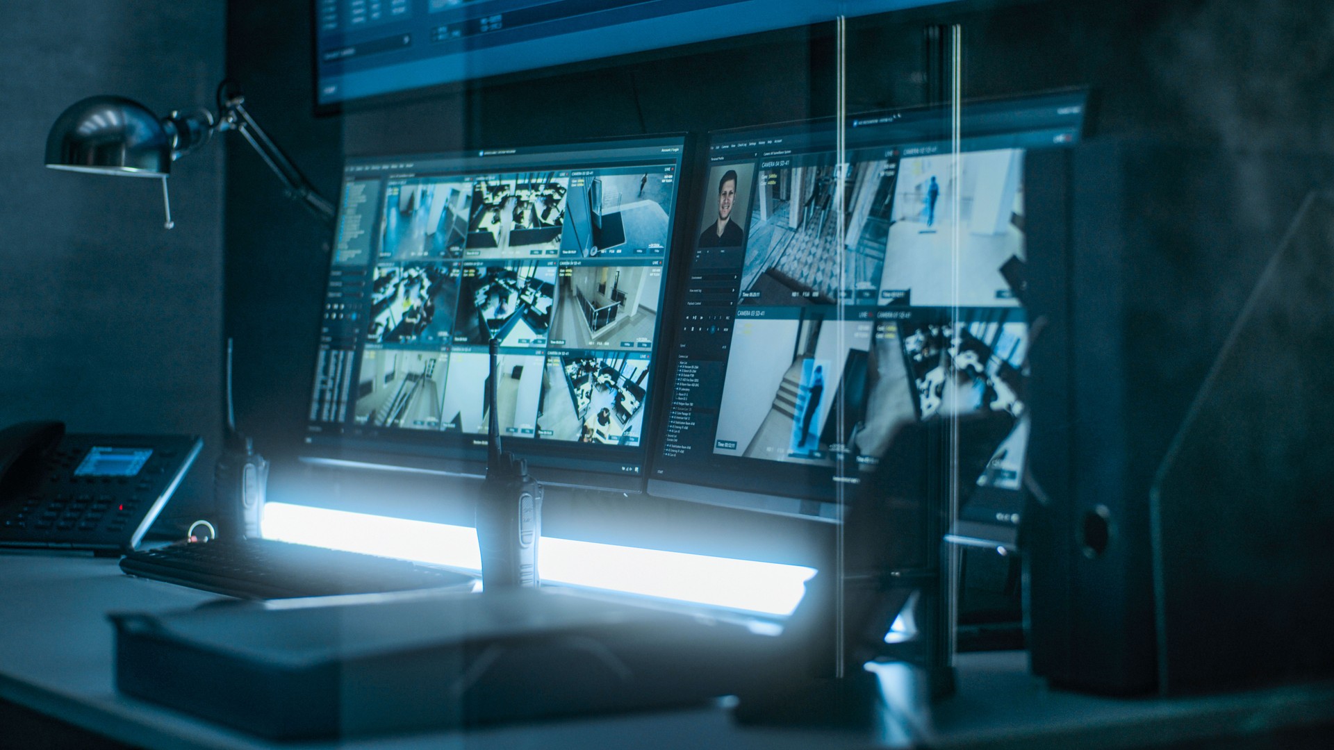 Surveillance footage from security cameras with face recognition on computer monitors